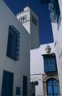 TUNISIA, Sidi Bou Said, "Part view of white painted mosque with decorative, blue painted balconies,