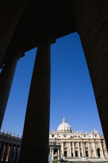 ITALY, Lazio, Rome, Vatican City The Basilica of St Peter seen through the pillars of the