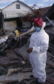 USA, Louisiana, New Orleans, "Aftermath of 2005 Hurricane Katrina, woman wearing protective