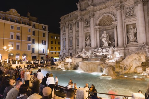 ITALY, Lazio, Rome, The 1762 Trevi Fountain by Nicola Salvi illuminated at night with tourists in