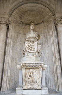 ITALY, Lazio, Rome, Colossal Statue of Sitting Rome Cesi Roma in a niche within the courtyard of