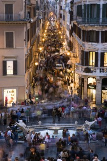 ITALY, Lazio, Rome, The Via dei Condotti the main shopping street busy with people illuminated at