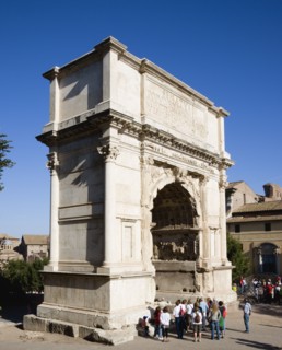 ITALY, Lazio, Rome, Tourists around the 19th Century reconstruction of the triumphal Arch of Titus