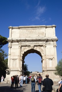 ITALY, Lazio, Rome, Tourists around the 19th Century reconstruction of the triumphal Arch of Titus