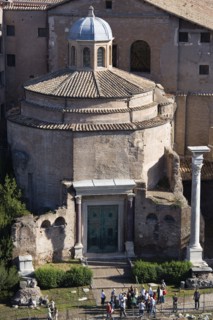 ITALY, Lazio, Rome, Tourists in the Forum outside the 4th Century Temple of Romulus which survived