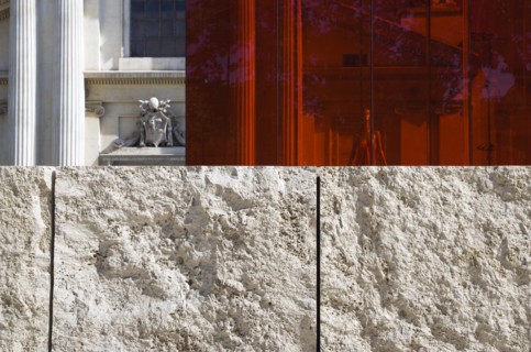 ITALY, Lazio, Rome, A red perspex cube part of a Valentino fashion exhibition behind a stone wall