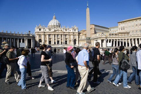 ITALY, Lazio, Rome, Vatican City Tourists in St Peter's Square in front of the Basilica