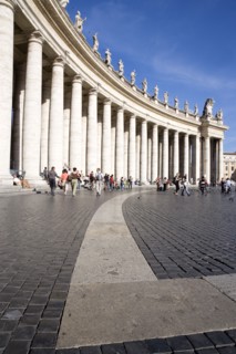 ITALY, Lazio, Rome, Vatican City Tourists in St Peter's Square beside the curving colonnade by