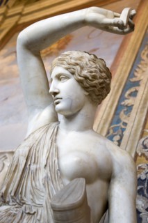 ITALY, Lazio, Rome, Vatican City Museum Marble statue of a semi naked woman with one arm raised in