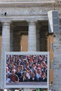 ITALY, Lazio, Rome, Vatican City Pilgrims seen on a large video TV monitor display in St Peter's