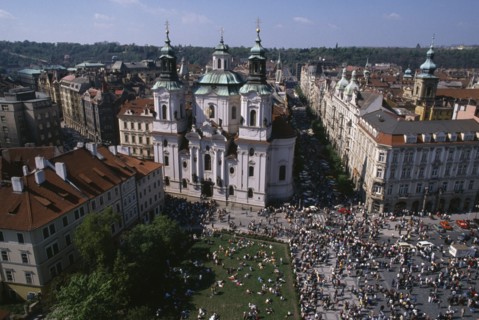 CZECH REPUBLIC, Prague, Elevated view over Old Town Square crowds and surrounding architecture.
