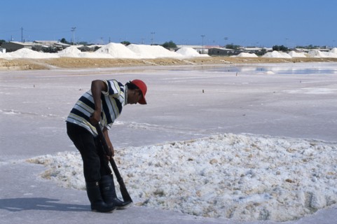 COLOMBIA, La Guajira, Manaure, Salt Mine worked by Guajiro / Wayu Indians. Male worker wearing a