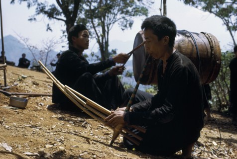 LAOS, Tribal People, Meo Tribe, Meo men playing musical instruments during the traditional ox