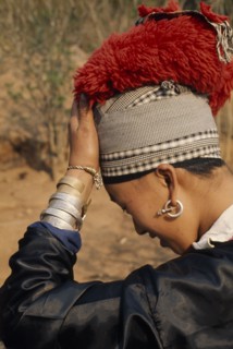 LAOS, Tribal People, Meo Tribe, Young Meo bride wearing jewellery and an elaborate red head-dress