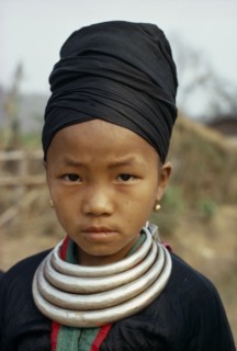 LAOS, Tribal People, Meo Tribe, Head and shoulders portrait of a Meo girl wearing traditional dress