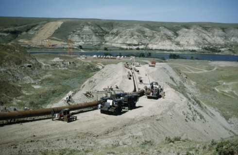 CANADA, Saskatchewan, Prairies, Constructing Trans Canada gas pipeline over Saskatchewan Prairies.