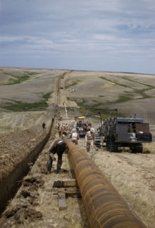 CANADA, Saskatchewan , Prairies, Constructing Trans Canada gas pipeline over Saskatchewan Prairies.
