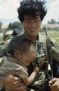 VIETNAM, Central Highlands, Kontum, Vietnam War. Siege of Kontum. Montagnard soldier carrying his