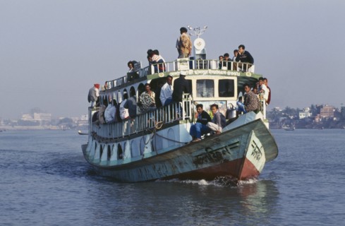 BANGLADESH, Dhaka, "Steamer ferry on river, crowded with passengers."