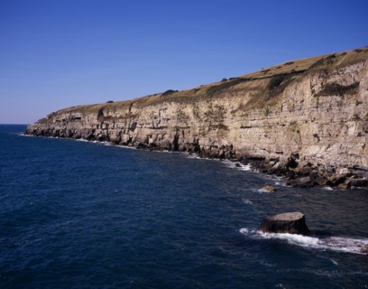 ENGLAND, Dorset, Jurassic Coastline, View west from Seacombe Quarry across the sea towards Winspit
