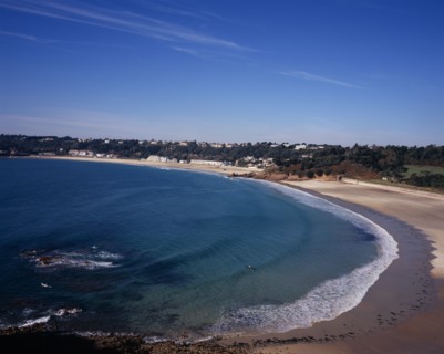 UNITED KINGDOM, Channel Islands, Jersey, Ouaisne Bay with St Brelade’s Bay beyond