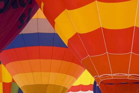 SWITZERLAND, Canton de Vaud, Chateau d'Oex, Patterns of a number of inflated Hot Air Balloons close
