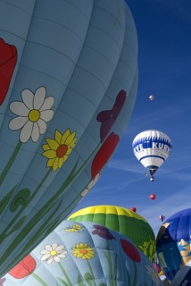 SWITZERLAND, Canton de Vaud, Chateau d'Oex, Hot Air Balloons taking off and framed by sections of