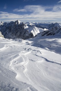 GERMANY, Bavaria, Zugspitze, Vista south from Zugspitzplatt with dramatic sky.