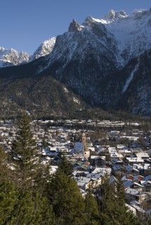GERMANY, Bavaria, Mittenwald, View over Mittenwald town rooftops from surrounding hillside with