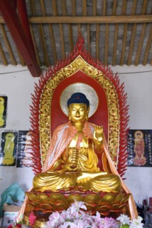 CHINA,  Zhejiang, Zhoushan, Buddha at Seven Stars Temple a poor temple