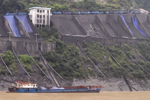 CHINA, Hubei , Sandouping, Industrial complex in the Wu Gorge. Line of trucks bring coal from the
