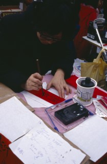 ENGLAND, London, Chinese New Year, Calligraphist writing Western names in Chinese during New Year