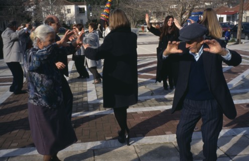 GREECE, Thessalia, Mega Monastiri, Dancing in the village square during New Year carnival.