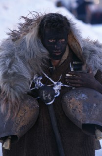 GREECE, North, Volakas, Reveller dressed as an Arapis during New Year carnival in village near