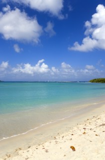 WEST INDIES, Grenada, Carriacou, Waves breaking on Paradise Beach at L'Esterre Bay with the