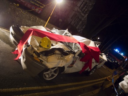 TRANSPORT, Road, Cars, Wrecked car wrapped in red bow as part of a police anti Drink Drive campaign