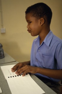 CARIBBEAN, Grenada, St Vincent, Boy learning Braille at St Pauls School for the blind