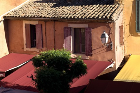 FRANCE, Provence Cote d’Azur, Vaucluse, "Roussillon.  Provencal colours in the town centre,