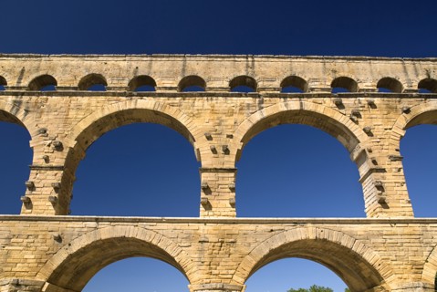 FRANCE, Provence Cote d’Azur, Gard, Pont du Gard.  Close up detail of section of three tiers of