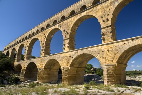 FRANCE, Provence Cote d’Azur, Gard, Pont du Gard.  Angled view of Roman aqueduct from the west side