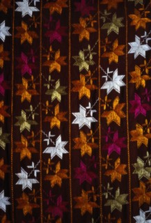 INDIA, Punjab, Textiles, "Detail of pink, orange and white Punjabi Phulkari embroidered textile