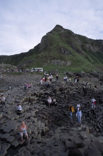 NORTHERN IRELAND, County Antrim, Giants Causeway, Visitors walking over the interlocking basalt