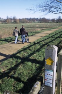 ENGLAND, West Sussex, Midhurst, Country footpath with information sign for ramblers at Cowdray