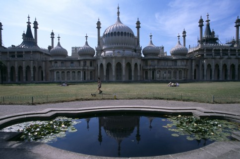 ENGLAND, East Sussex, Brighton, The Royal Pavilion exterior seen from across lilly pond.