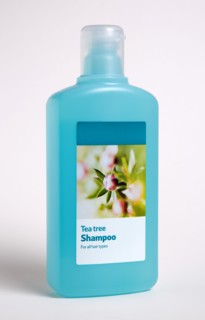 HEALTH, Hygiene, Washing Hair, A blue plastic bottle of Tea Tree shampoo on a white background