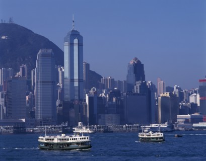 CHINA, Hong Kong, Victoria Harbour, Star Ferries crossing Victoria Harbour with high rise buildings