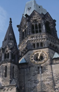 GERMANY, Berlin, Kaiser Wilhelm Memorial Church. Part view of ruined gothic exterior with clock