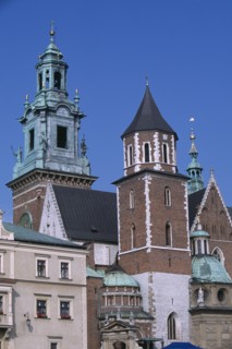 POLAND, Krakow, Detail of Wawel Cathedral exterior with clock tower above second tower and series