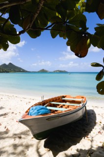WEST INDIES, Grenada, Carriacou, The calm clear blue water breaking on Paradise Beach in L'Esterre