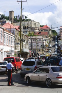 WEST INDIES, Grenada, St George, Male corporal of the Royal Grenadian Police Force directs traffic